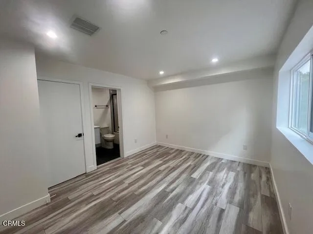 a bathroom with a sink toilet a mirror and shower