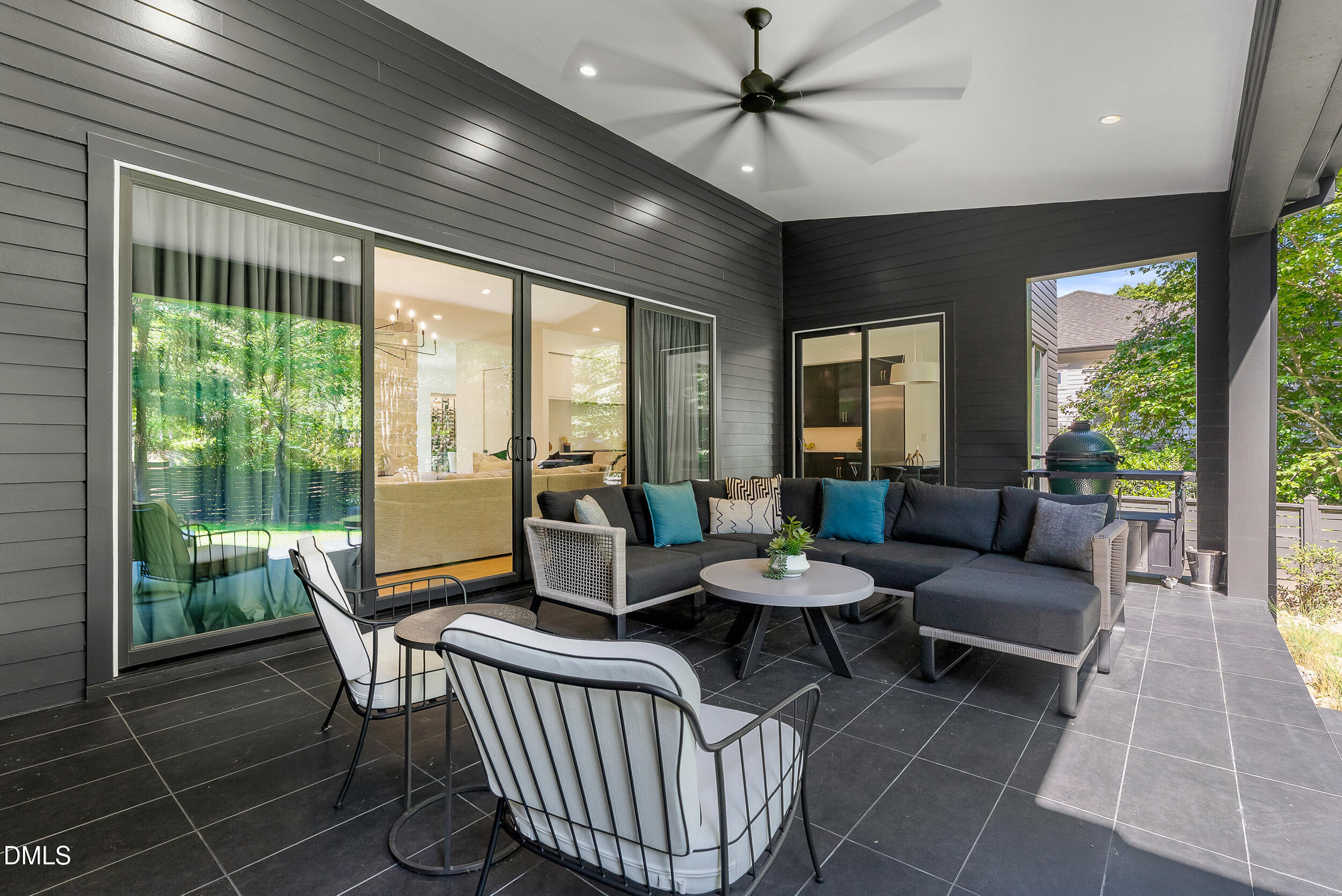 2105 Manuel Street Raleigh, NC 27612 - Photo 51 of 63 a living room with furniture and a floor to ceiling window