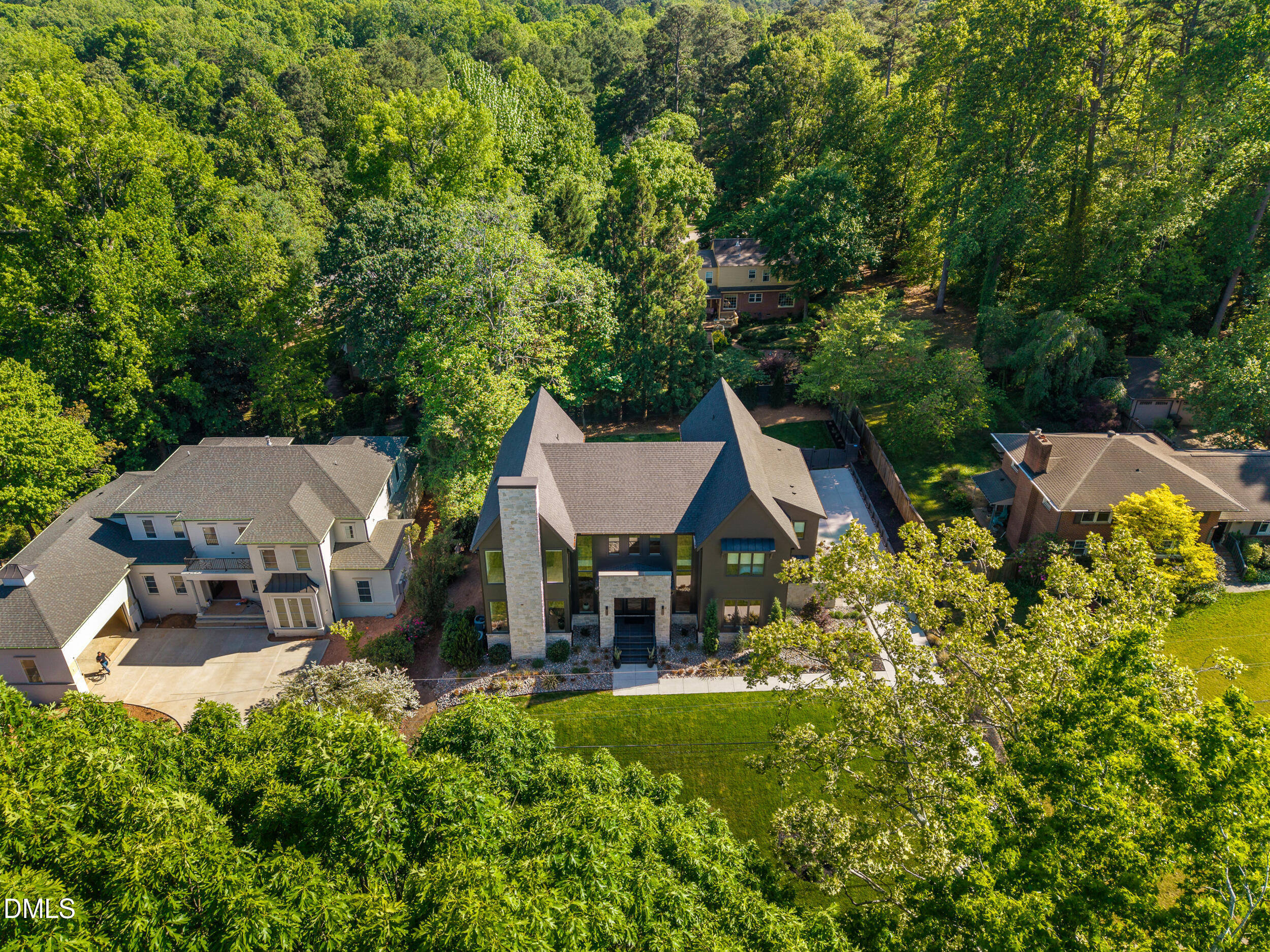 2105 Manuel Street Raleigh, NC 27612 - Photo 59 of 63 an aerial view of a house with swimming pool and big yard