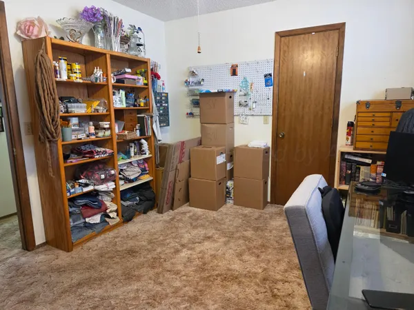 a workspace with furniture and closet