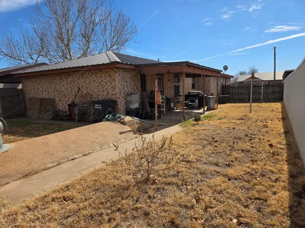 a view of a house with snow on the road
