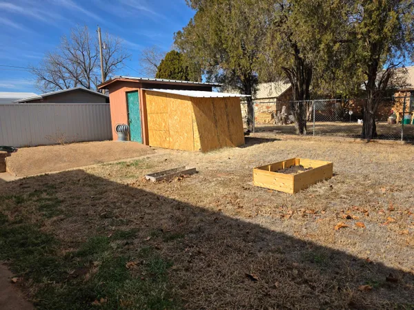 a view of yard along with trees