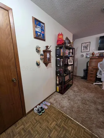 a view of a bedroom with toys and closet
