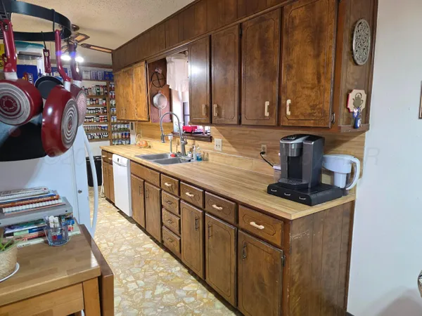 a kitchen with stainless steel appliances a sink and a stove