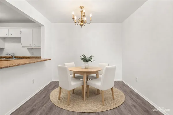 a dining room with table and chairs