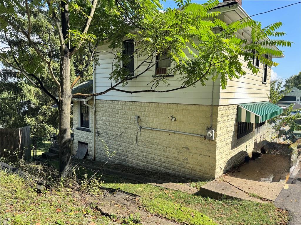 730 Hiland Avenue Coraopolis, PA 15108 - Photo 3 of 4 a view of a tree in front of a house