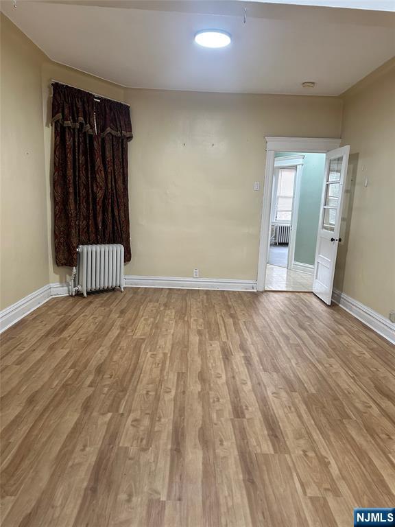 141 67th Street, Unit 2 West New York, NJ 07093 - Photo 3 of 12 a view of room with wooden floor