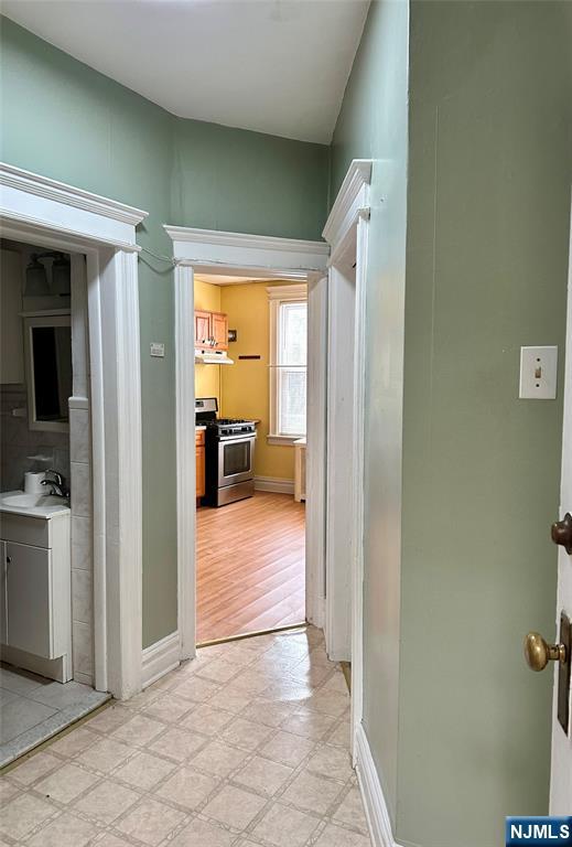 141 67th Street, Unit 2 West New York, NJ 07093 - Photo 6 of 12 a view of a hallway and a livingroom with furniture
