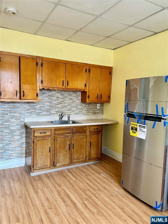 141 67th Street, Unit 2 West New York, NJ 07093 - Photo 9 of 12 a kitchen with stainless steel appliances granite countertop a sink a stove top oven a counter space and cabinets