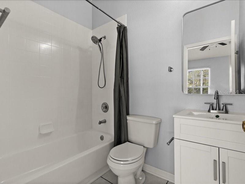 29924 Playa Del Rey Lane Wesley Chapel, FL 33543 - Photo 16 of 31 a bathroom with a sink toilet and shower