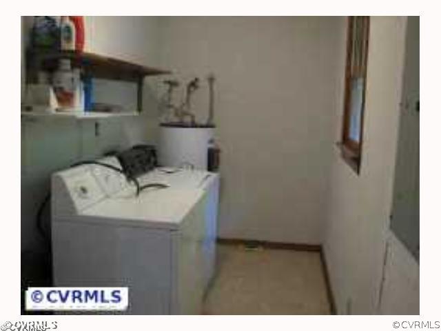 4828 Bradshaw Road Gum Spring, VA 23065 - Photo 7 of 10 a kitchen with a sink and a refrigerator