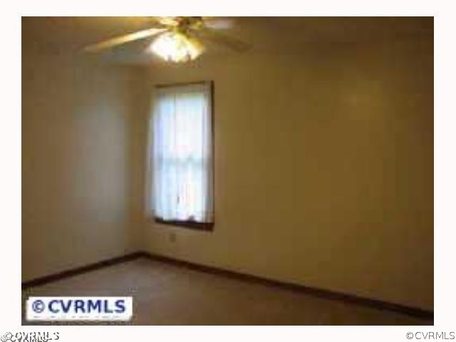 4828 Bradshaw Road Gum Spring, VA 23065 - Photo 8 of 10 a view of an empty room and window wooden floor
