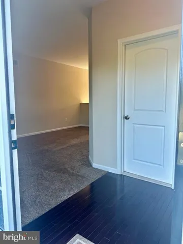 a view of a pathway with a garden