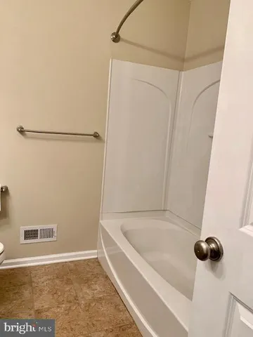 an empty room with a chandeliers