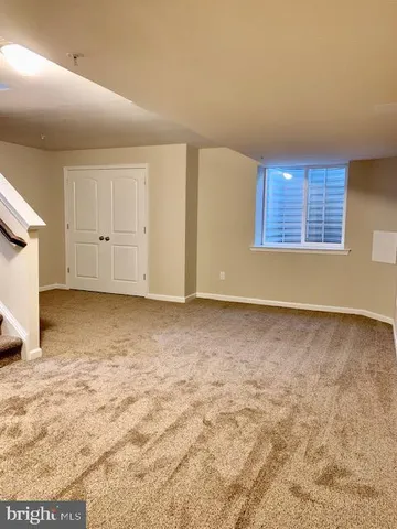 a view of house with backyard and sitting area