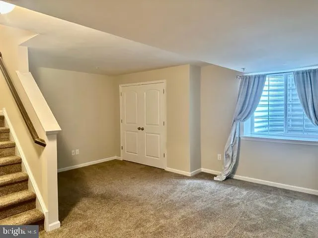 an empty room with a fireplace