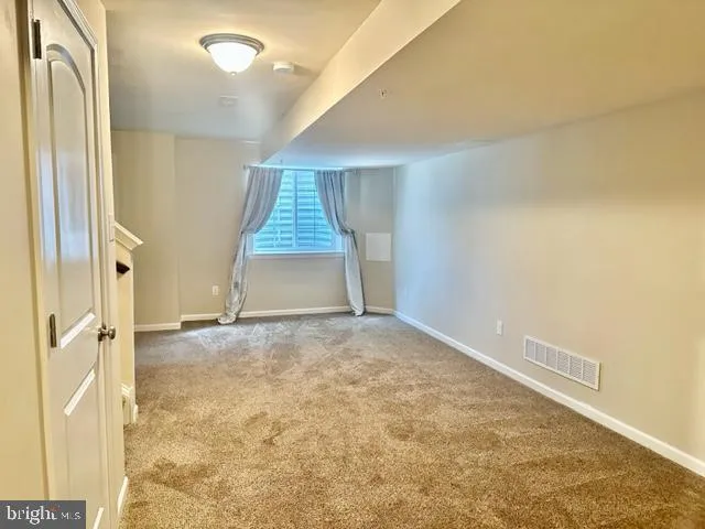 a car parked in front of the house and cars parked