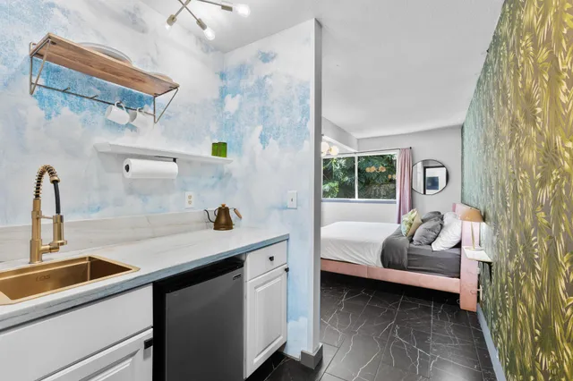 a view of a balcony with wooden floor and outdoor space