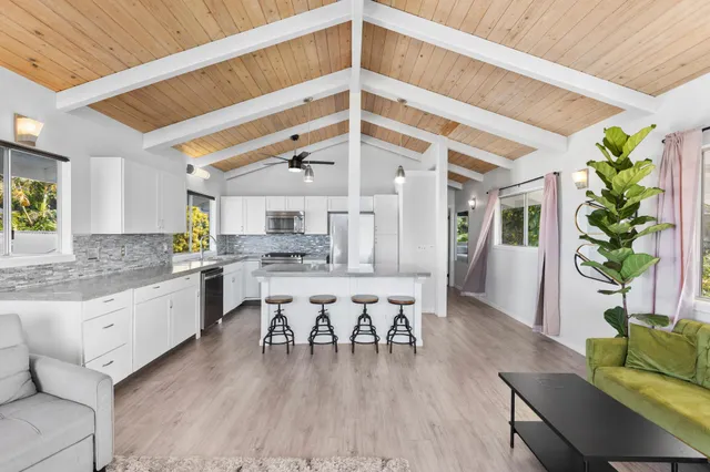 a kitchen with stainless steel appliances granite countertop a stove and a refrigerator