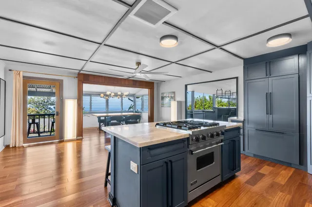 a kitchen with a stove and a refrigerator