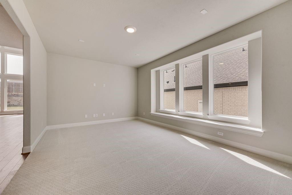 1231 Calebria Way Fate, TX 75087 - Photo 16 of 40 an empty room with windows
