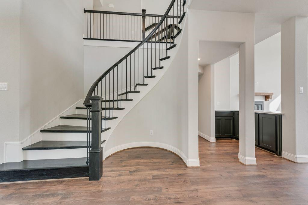 1231 Calebria Way Fate, TX 75087 - Photo 2 of 40 a view of entryway and hall with wooden floor
