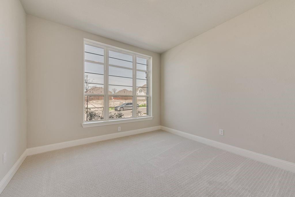 1231 Calebria Way Fate, TX 75087 - Photo 24 of 40 an empty room with a window