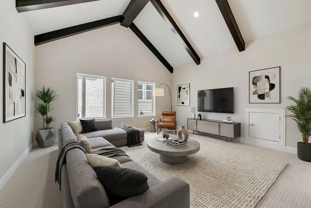 1231 Calebria Way Fate, TX 75087 - Photo 30 of 40 a living room with furniture and a flat screen tv