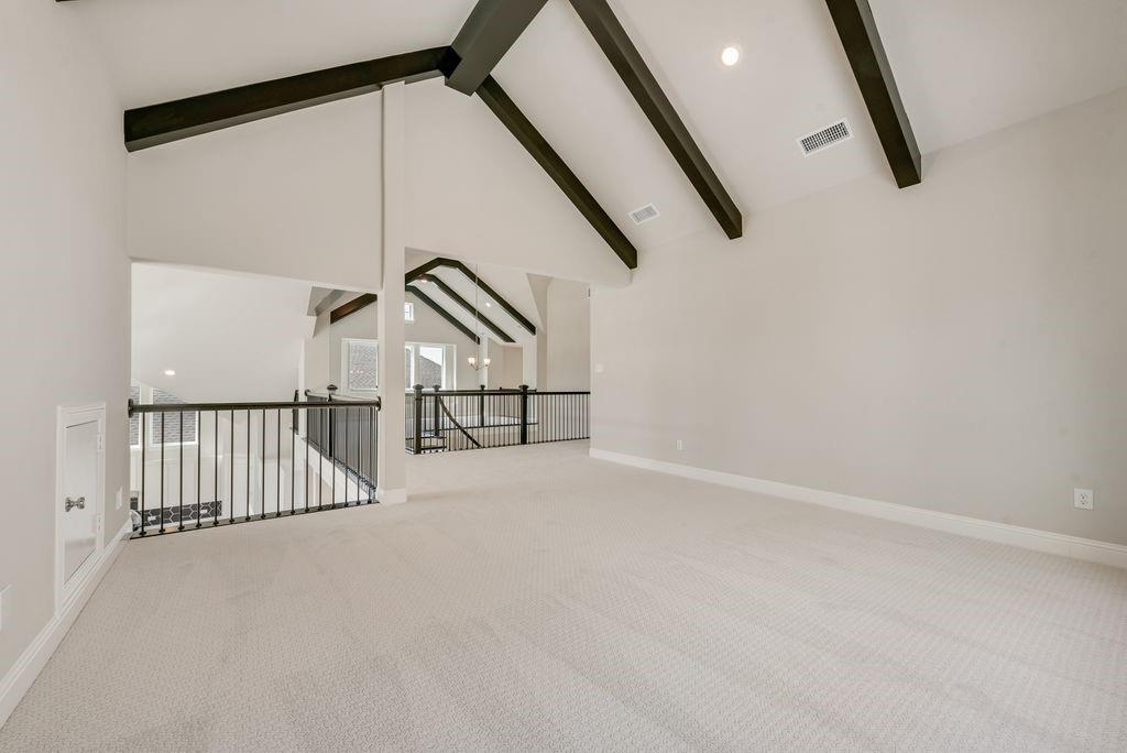 1231 Calebria Way Fate, TX 75087 - Photo 31 of 40 a view of staircase with railing and white walls