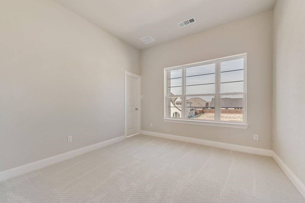 1231 Calebria Way Fate, TX 75087 - Photo 32 of 40 an empty room with a window