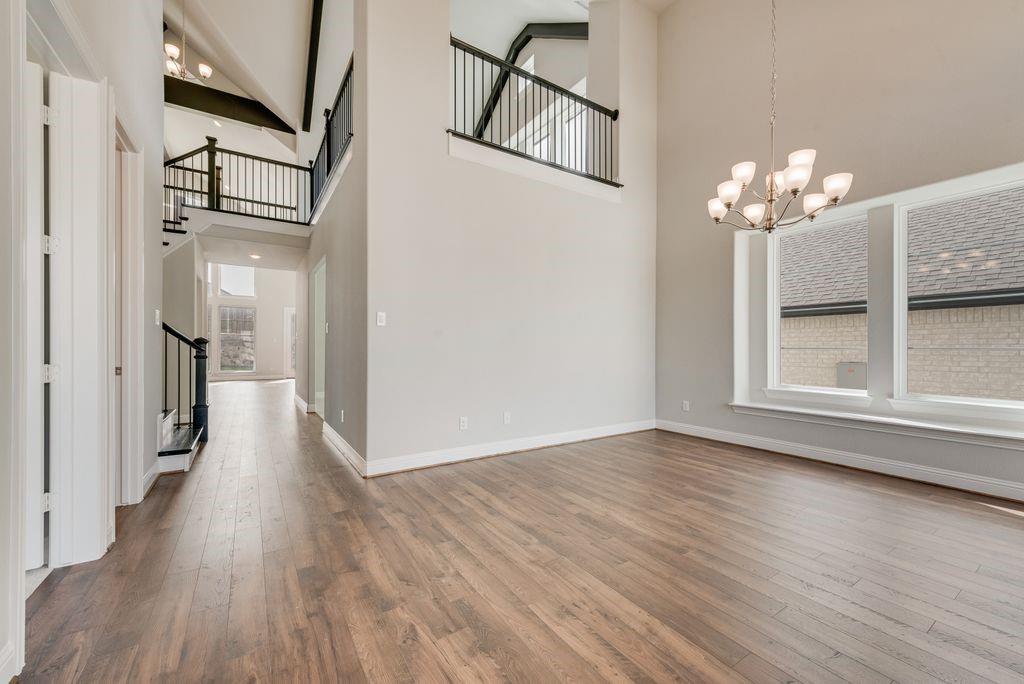 1231 Calebria Way Fate, TX 75087 - Photo 4 of 40 a view of a livingroom with wooden floor