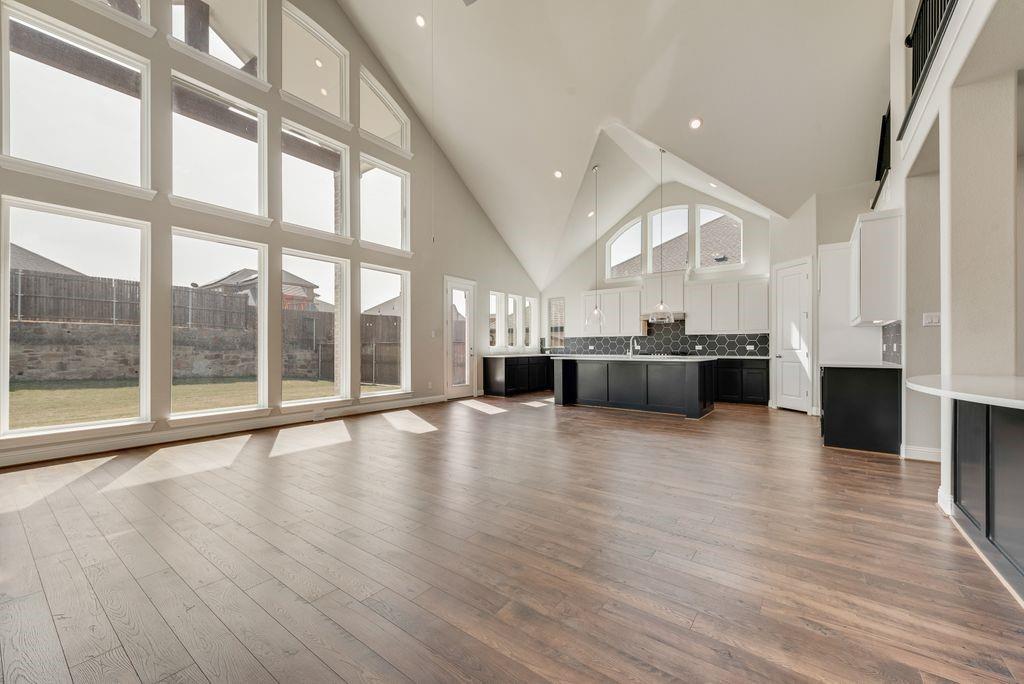 1231 Calebria Way Fate, TX 75087 - Photo 10 of 40 a view of kitchen with furniture and wooden floor