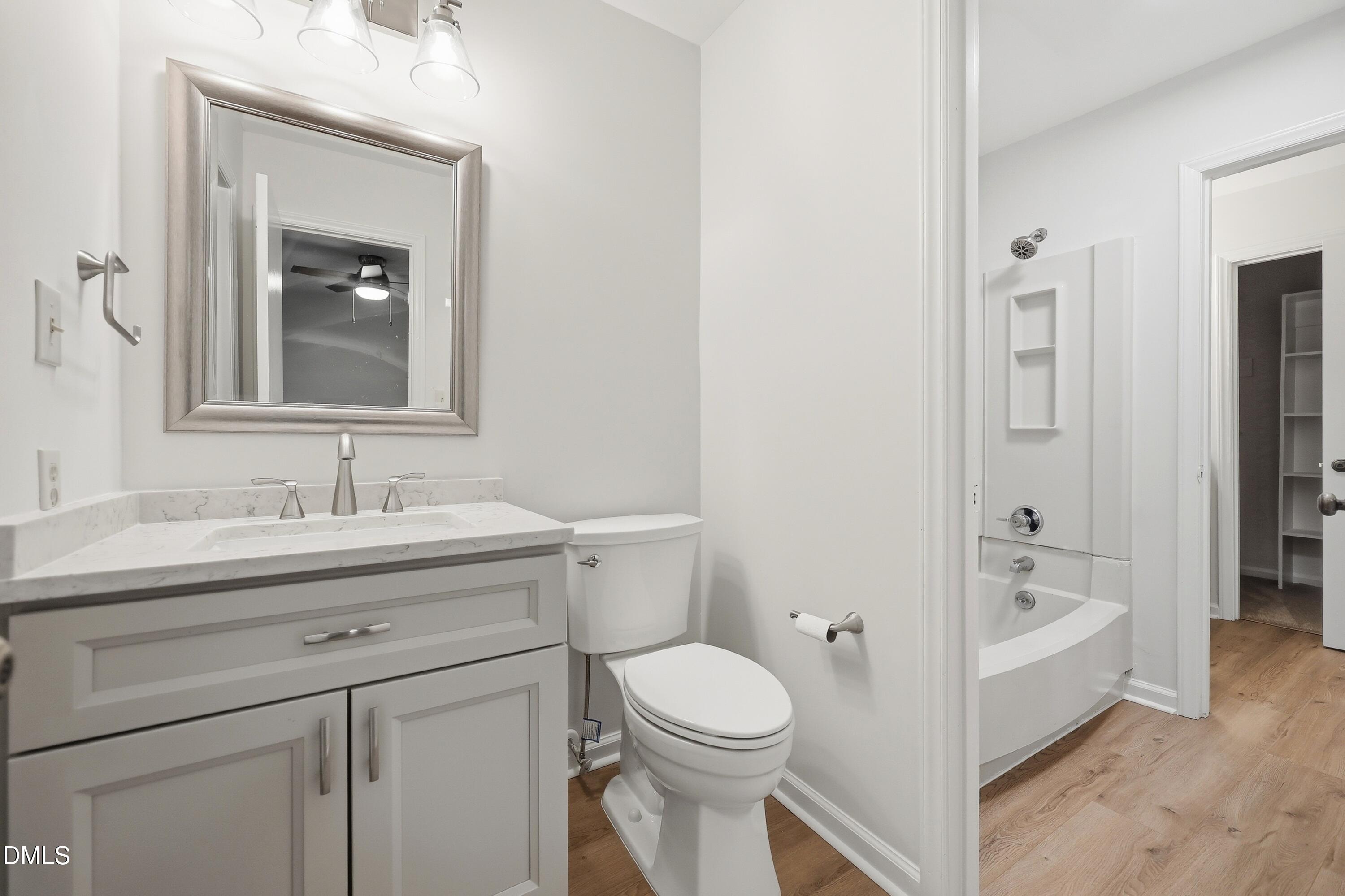 669 Bashford Road Raleigh, NC 27606 - Photo 11 of 19 a bathroom with a sink a toilet and shower