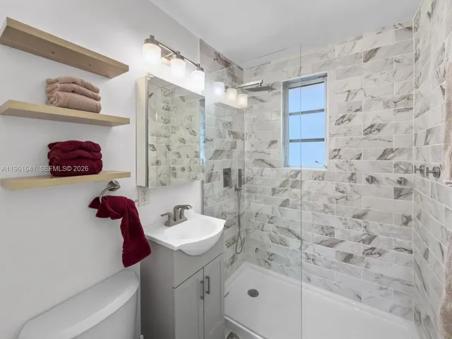 a bathroom with a sink and a shower