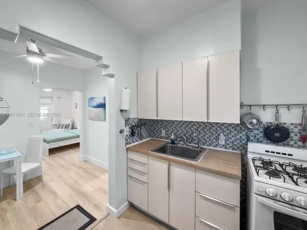 a kitchen with a stove and a sink