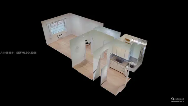 an aerial view of a house with a floor to ceiling window