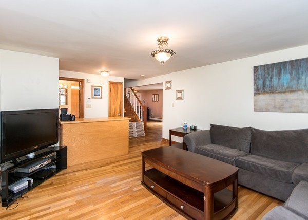 1131 Trapelo Road Waltham, MA 02451 - Photo 11 of 23 a living room with furniture and a flat screen tv