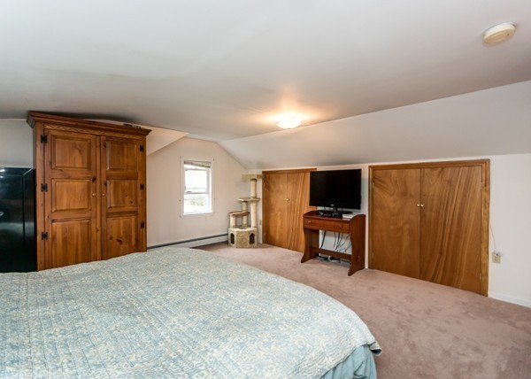 1131 Trapelo Road Waltham, MA 02451 - Photo 20 of 23 a bedroom with a bed and a television