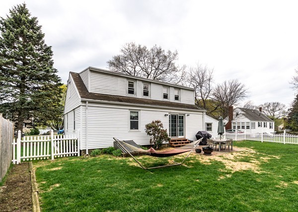 1131 Trapelo Road Waltham, MA 02451 - Photo 4 of 23 a view of a white house with a yard porch and sitting area