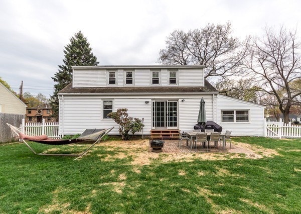 1131 Trapelo Road Waltham, MA 02451 - Photo 5 of 23 a backyard of a house with garden and outdoor seating
