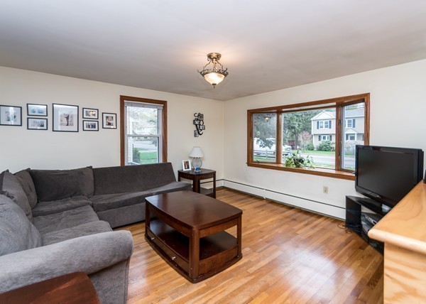 1131 Trapelo Road Waltham, MA 02451 - Photo 10 of 23 a living room with furniture a window and a flat screen tv