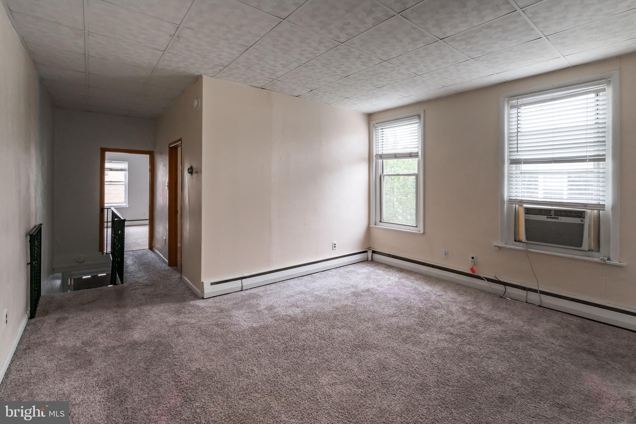 1325 West Porter Street Philadelphia, PA 19148 - Photo 2 of 17 an empty room with windows and closet