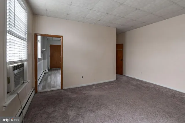 a bathroom with a toilet a sink and a shower