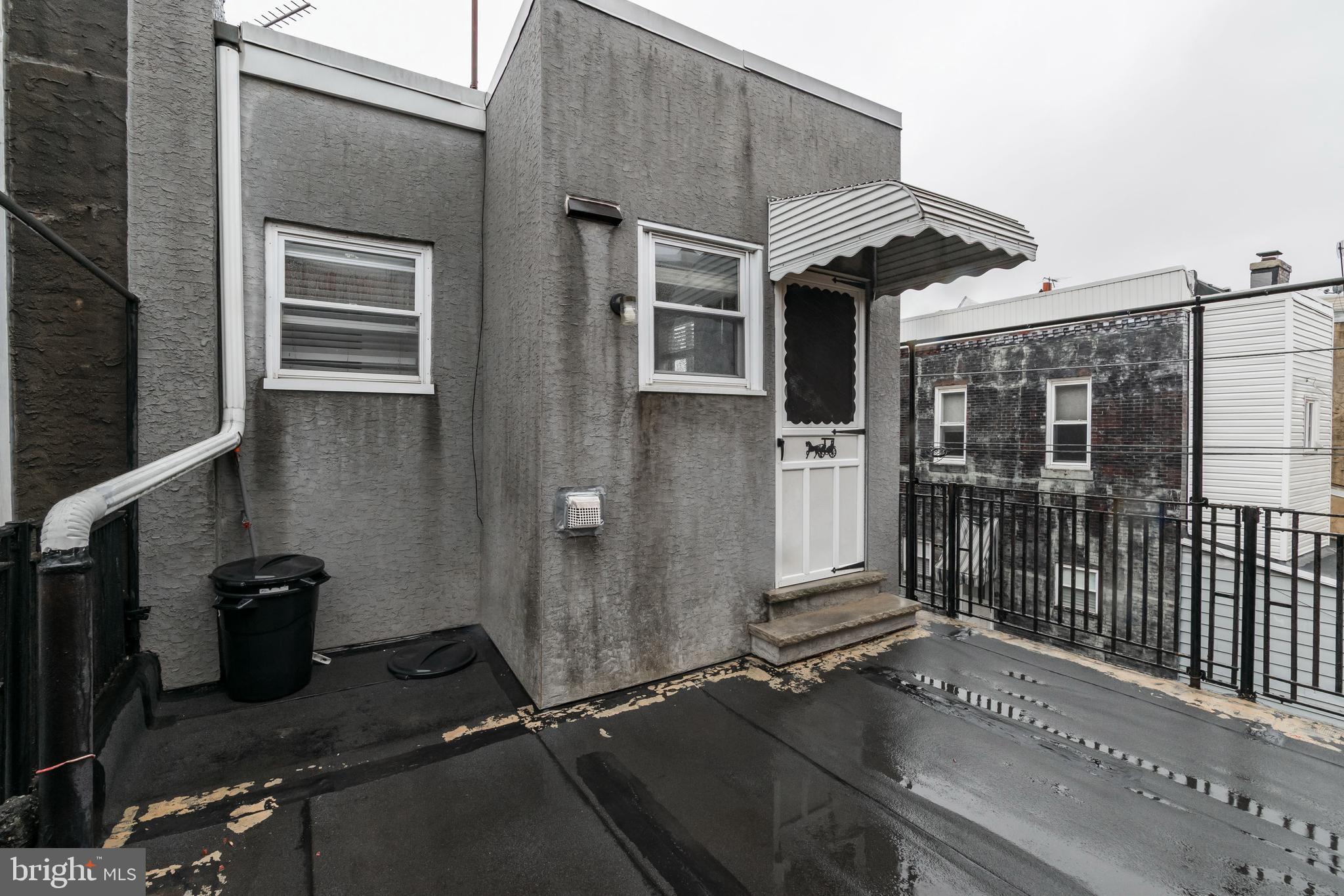 1325 West Porter Street Philadelphia, PA 19148 - Photo 9 of 17 a view of a brick house with many windows