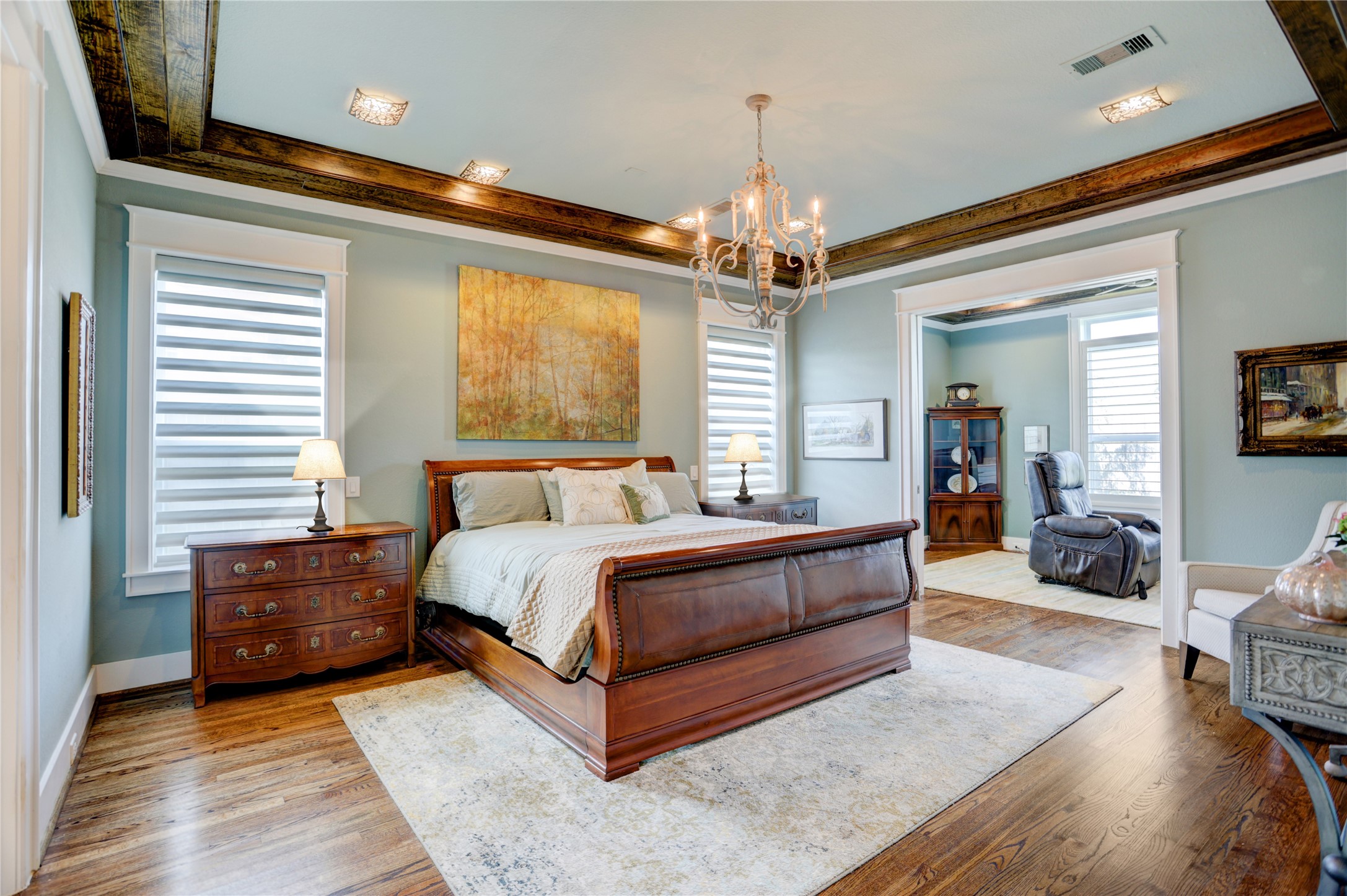 6430 Rolla Street Houston, TX 77055 - Photo 16 of 30 a spacious bedroom with a bed couch chandelier and a window