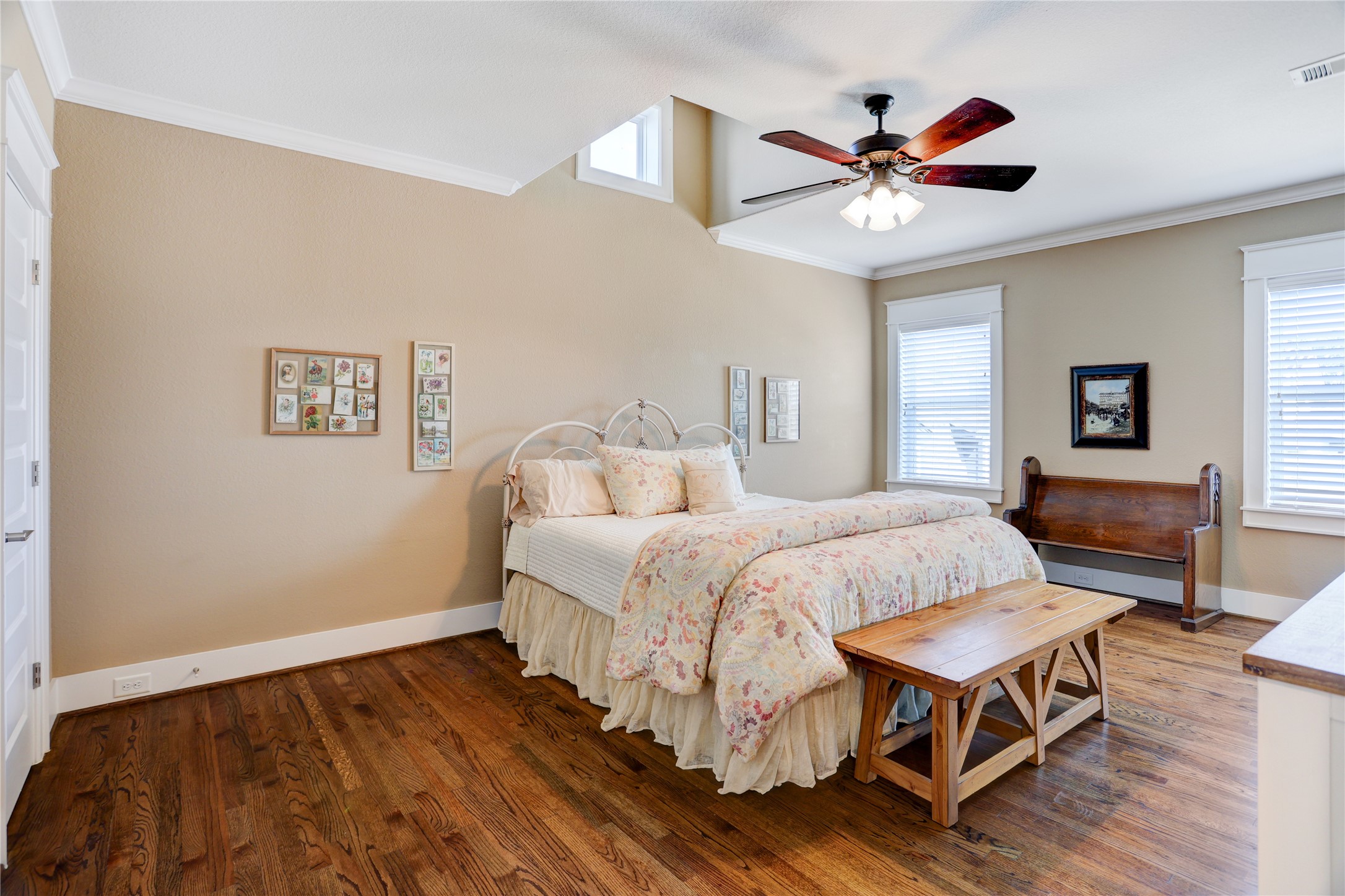 6430 Rolla Street Houston, TX 77055 - Photo 23 of 30 a spacious bedroom with a bed and a chandelier