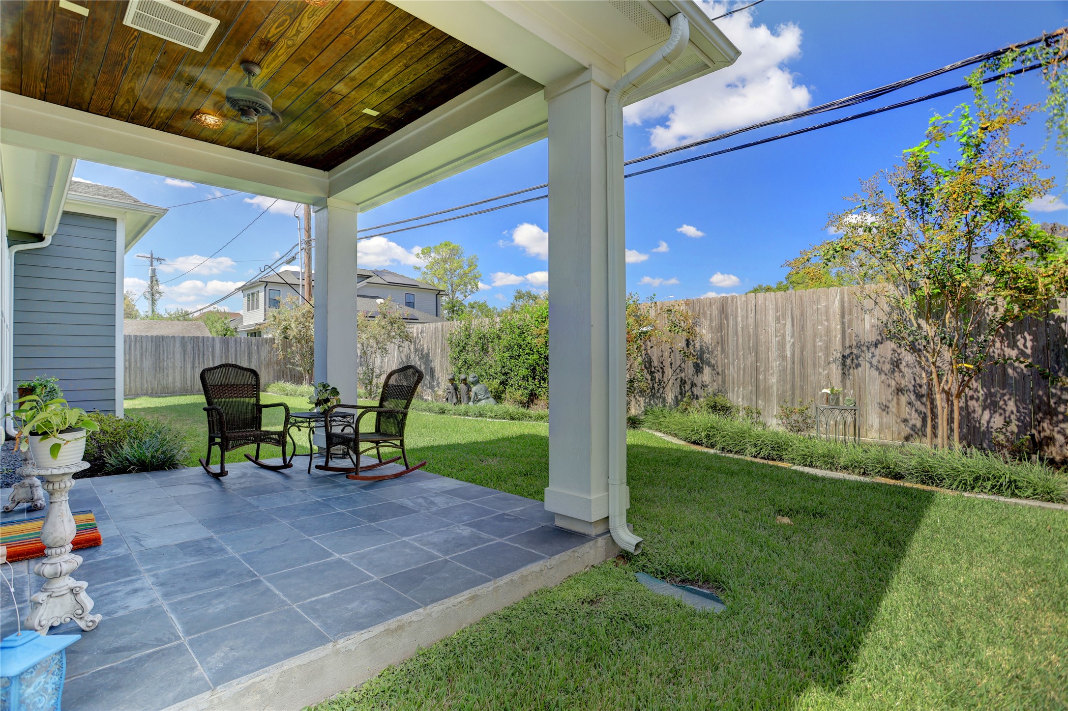 6430 Rolla Street Houston, TX 77055 - Photo 27 of 30 a view of a porch with chairs and backyard