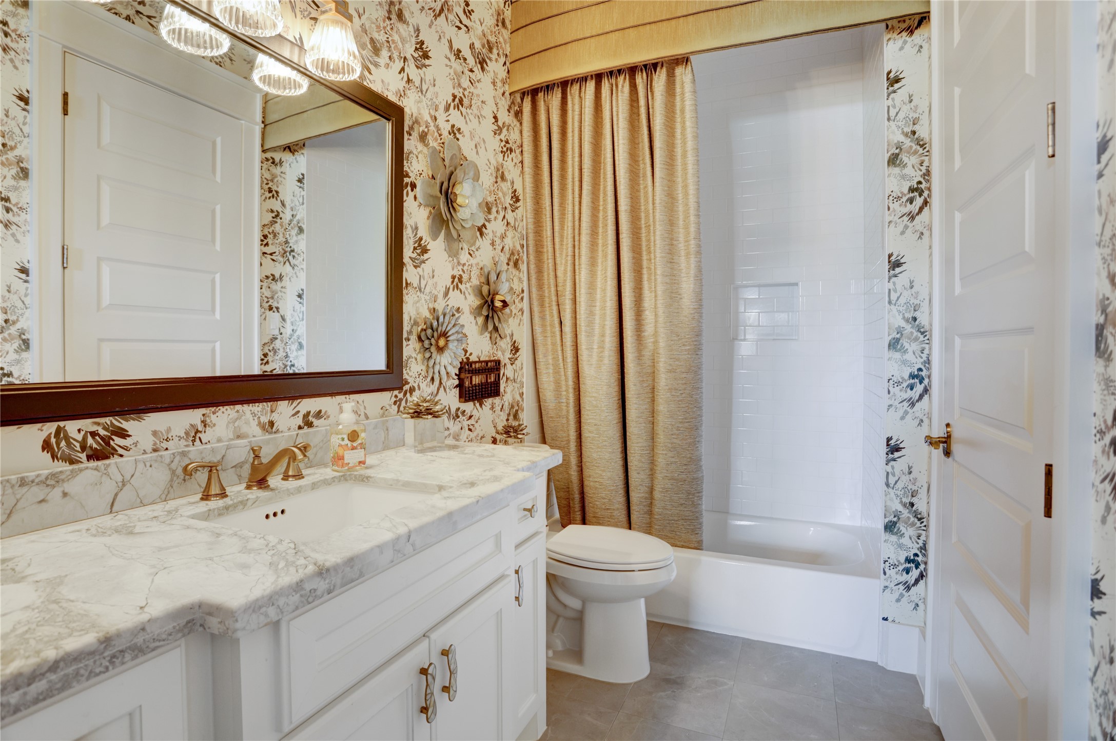 6430 Rolla Street Houston, TX 77055 - Photo 4 of 30 a bathroom with a sink and a mirror