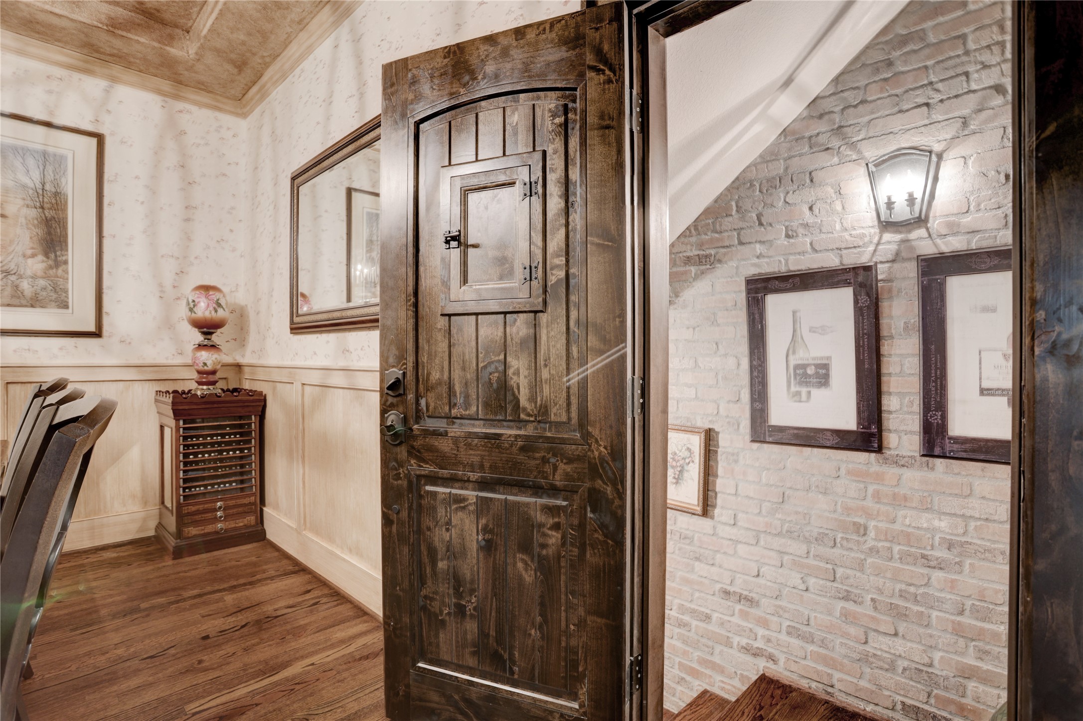 6430 Rolla Street Houston, TX 77055 - Photo 7 of 30 a view of a hallway with wooden floor and staircase