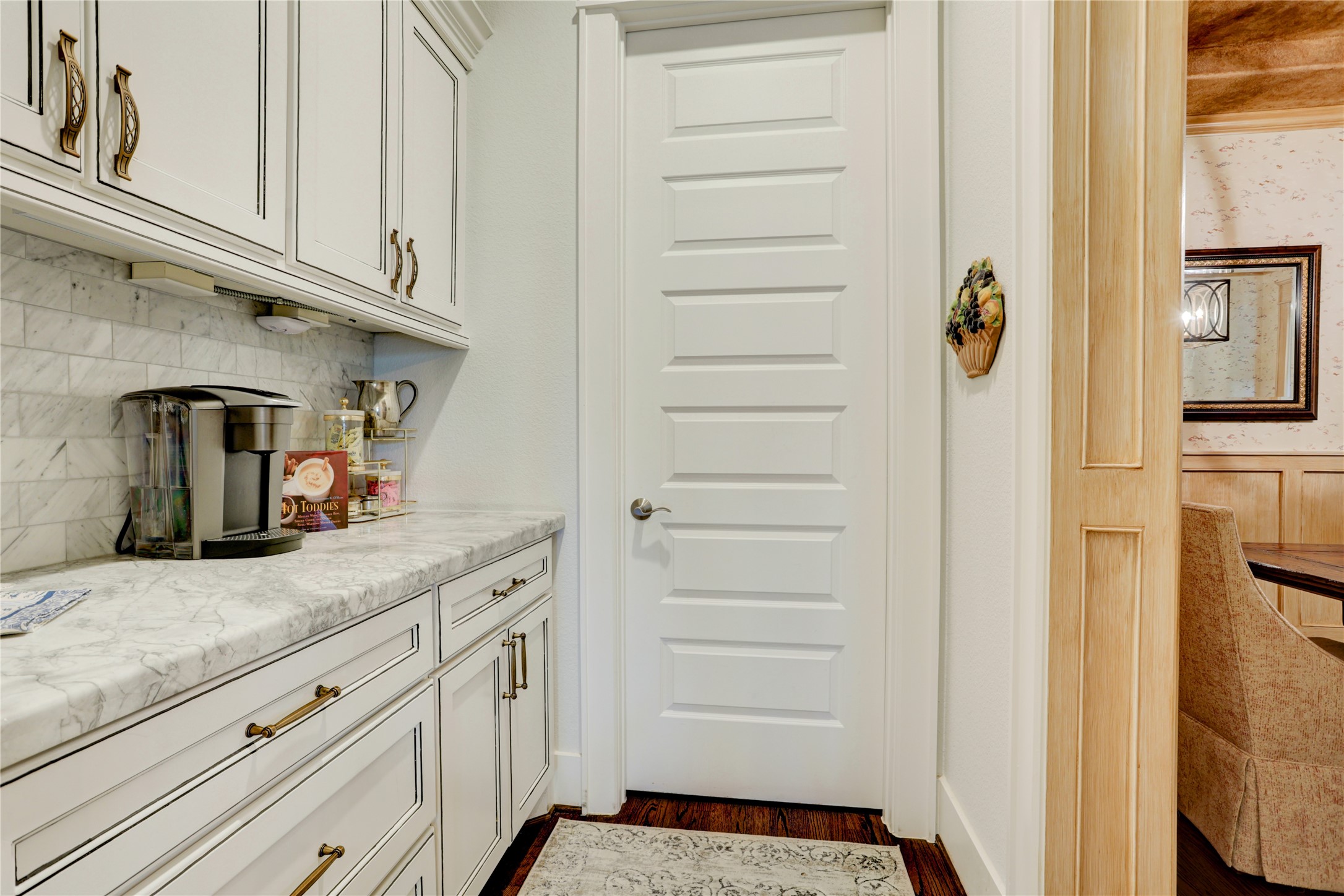 6430 Rolla Street Houston, TX 77055 - Photo 9 of 30 a kitchen with white cabinets and a sink